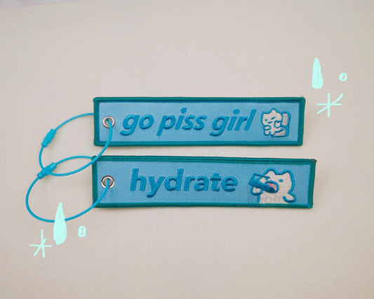 go piss girl keychain